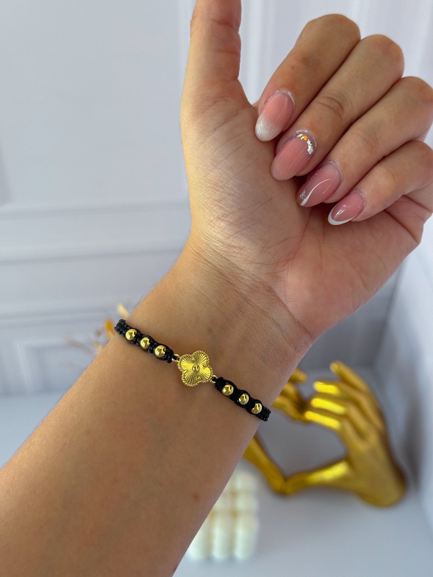 Black woven clover bracelet