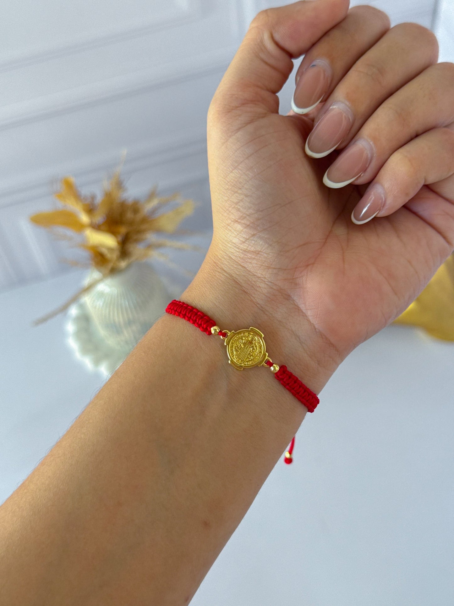 Simple bracelet woven with St. Benedict's medal