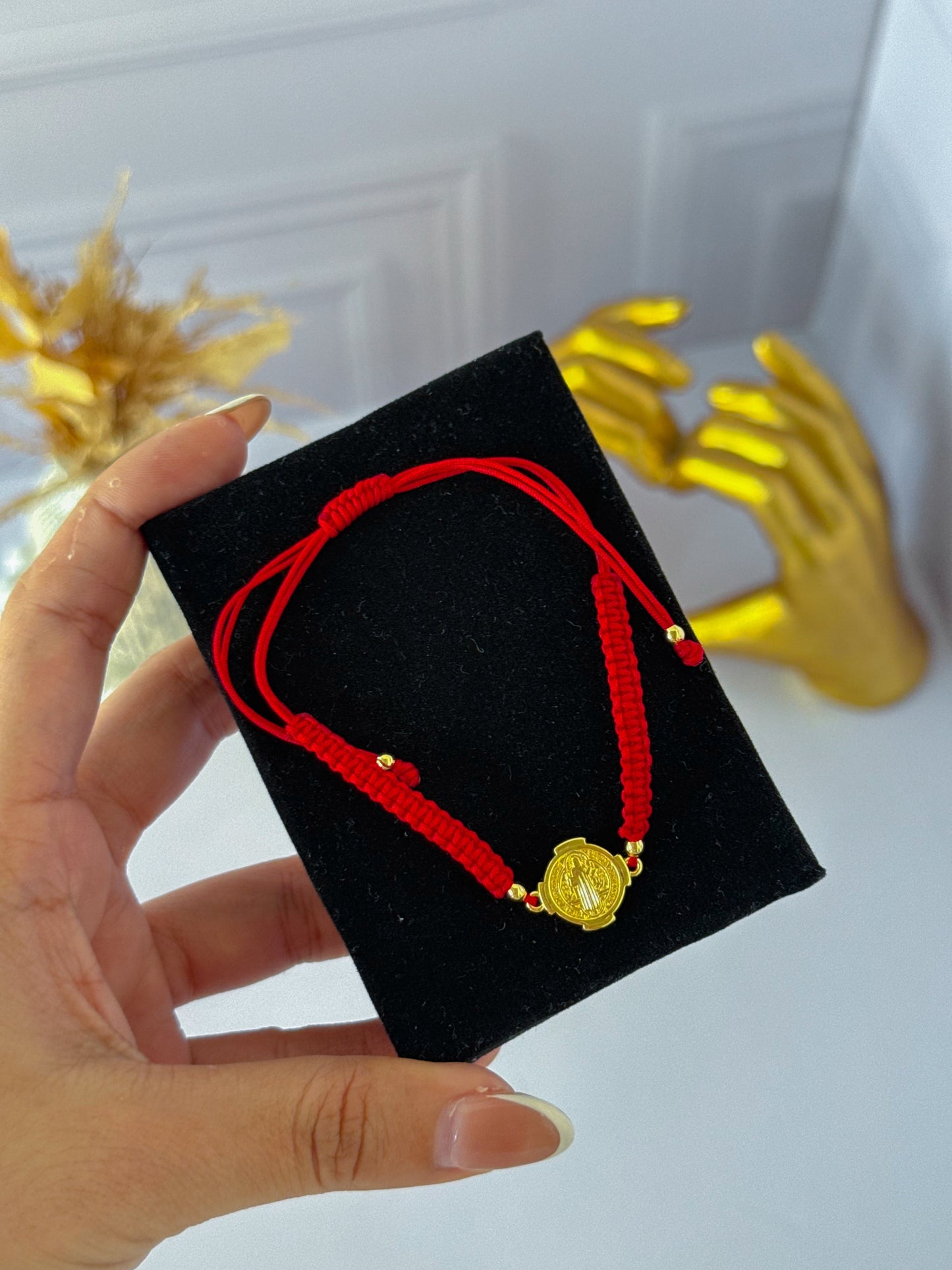 Simple bracelet woven with St. Benedict's medal