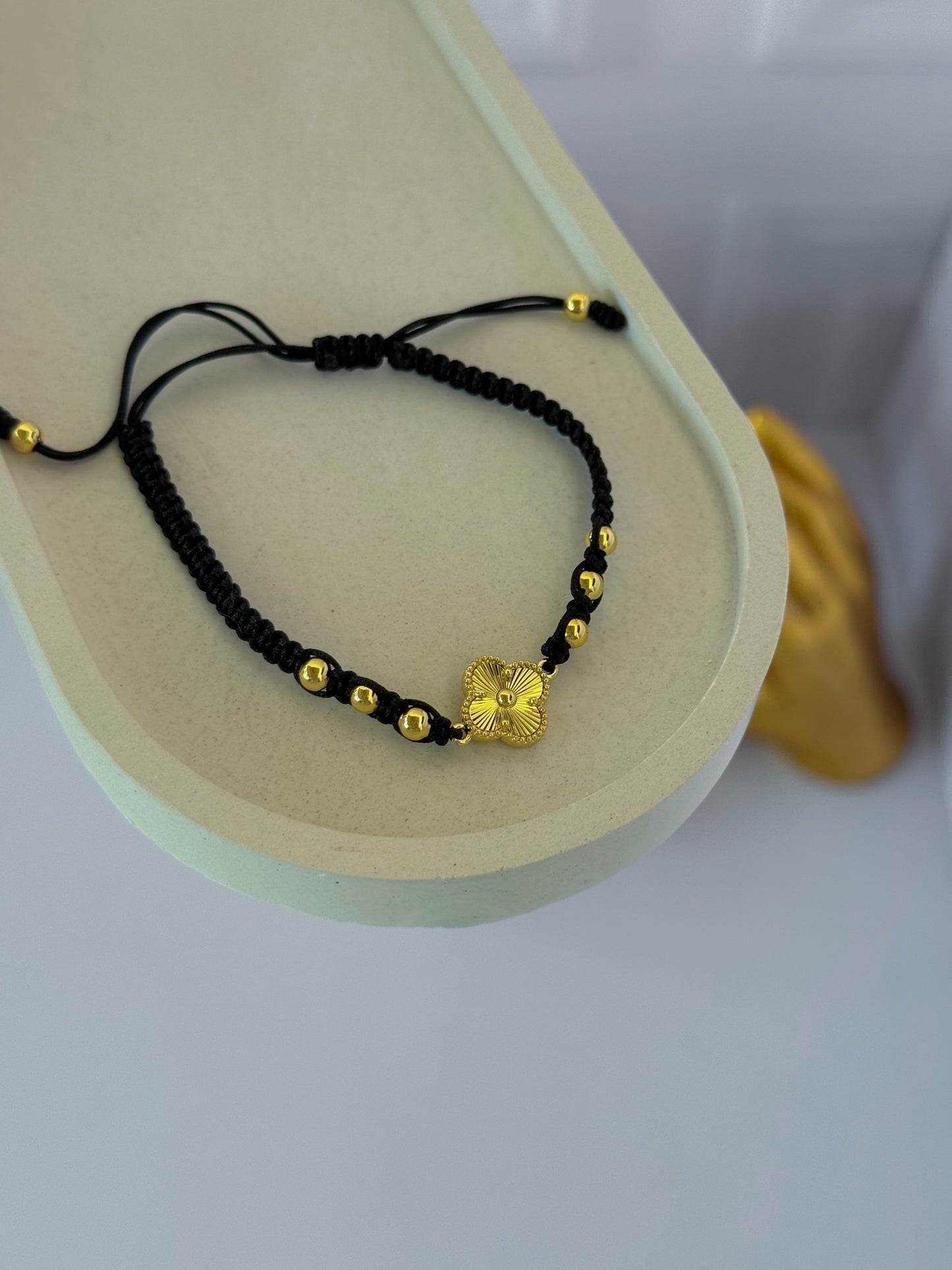 Black woven clover bracelet