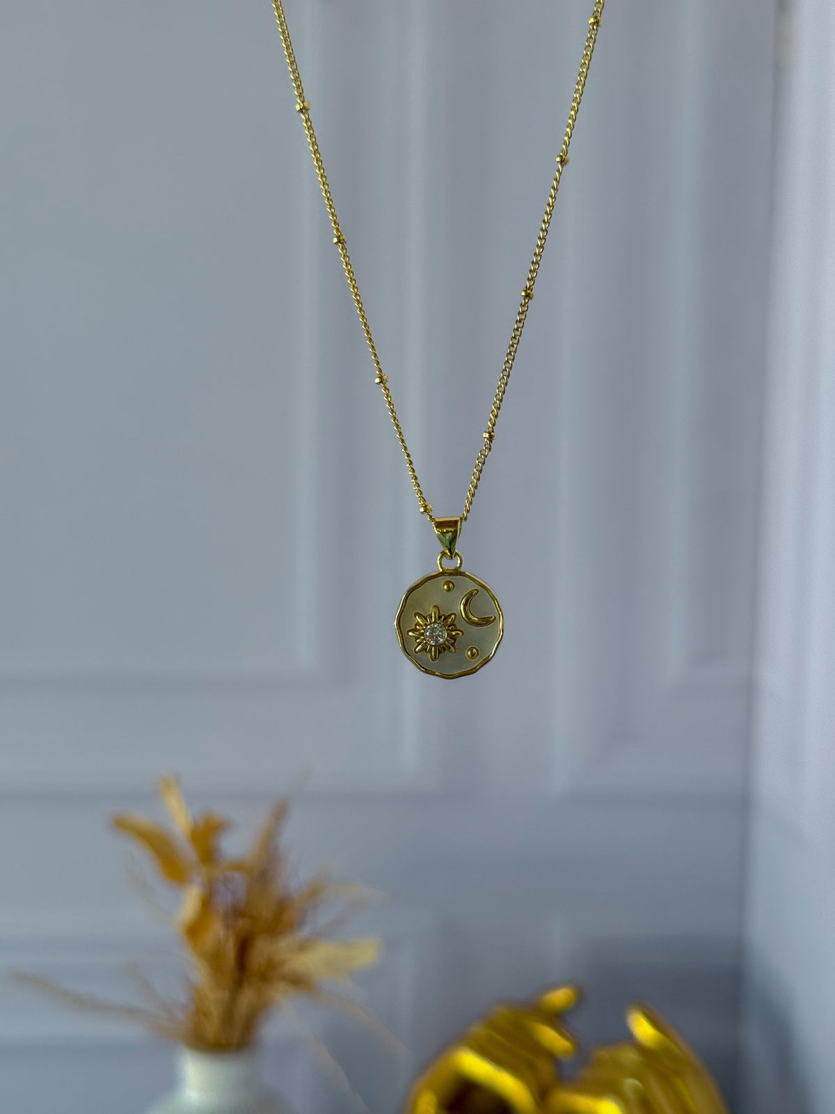Mother-of-pearl sun and moon necklace